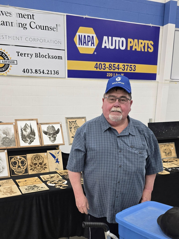 Anderson showcasing custom Sculpfun laser artwork on display at NAPA Auto Parts