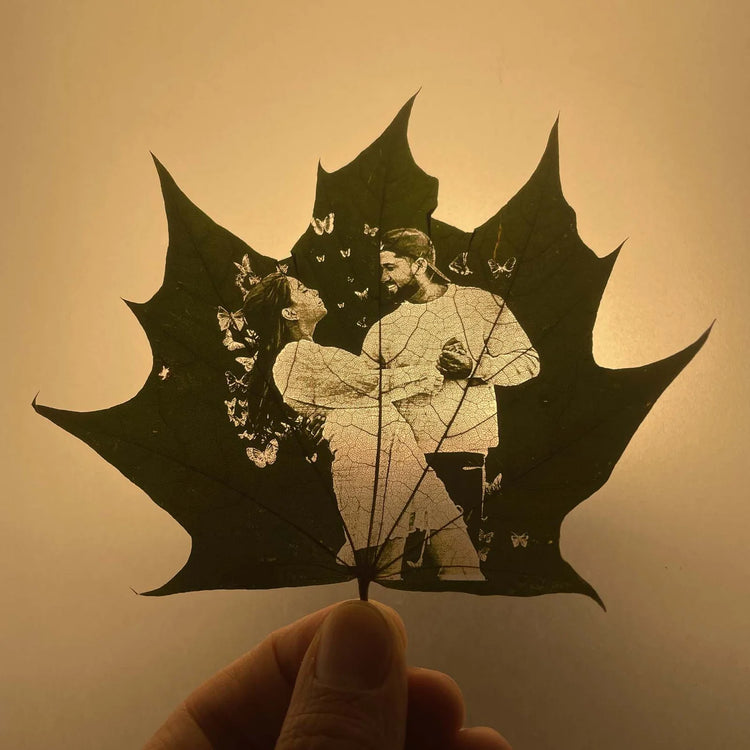 An artistic leaf of a couple embracing engraved by Sculpfun uv laser engraver